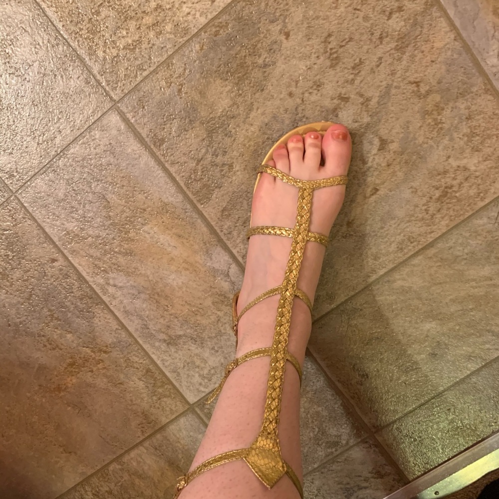 Gold knee high gladiator sandals